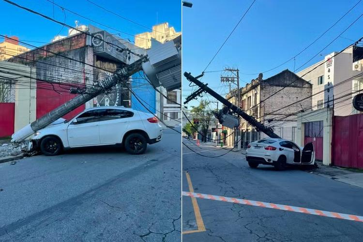 Motorista de BMW bate em poste, foge e causa apagão em Santos; VÍDEO
