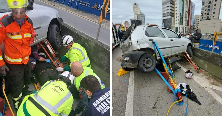 Motociclista é prensado contra mureta após caminhão atingir veículo parado na BR-101 em Itapema