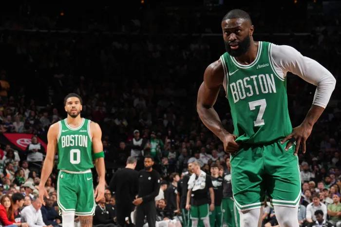 Jayson Tatum and Jaylen Brown on the court together during a game.