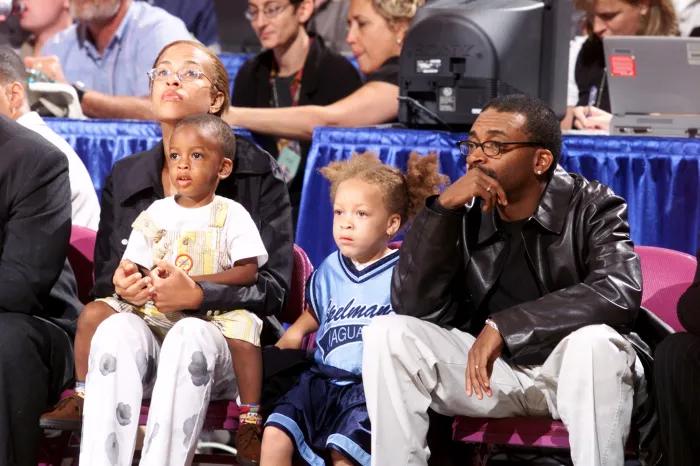 Film director Spike Lee and family attend the inaugural WNBA All-Star Game at Madison Square Garden.