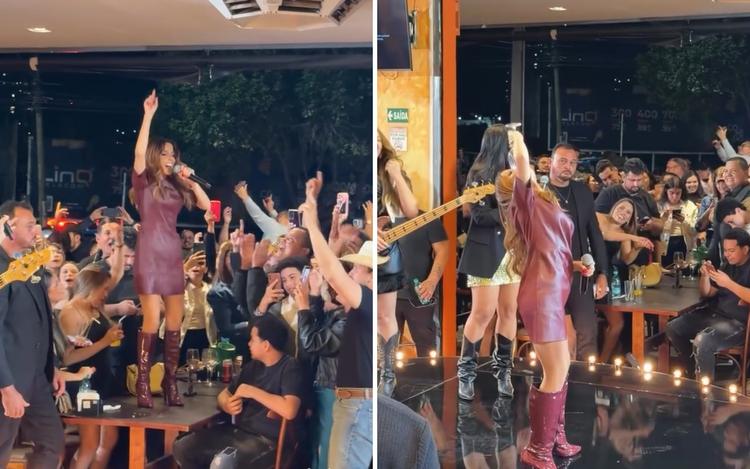 Maiara surpreende ao subir em mesa de bar para cantar e virar taça de vinho em Goiânia; vídeo
