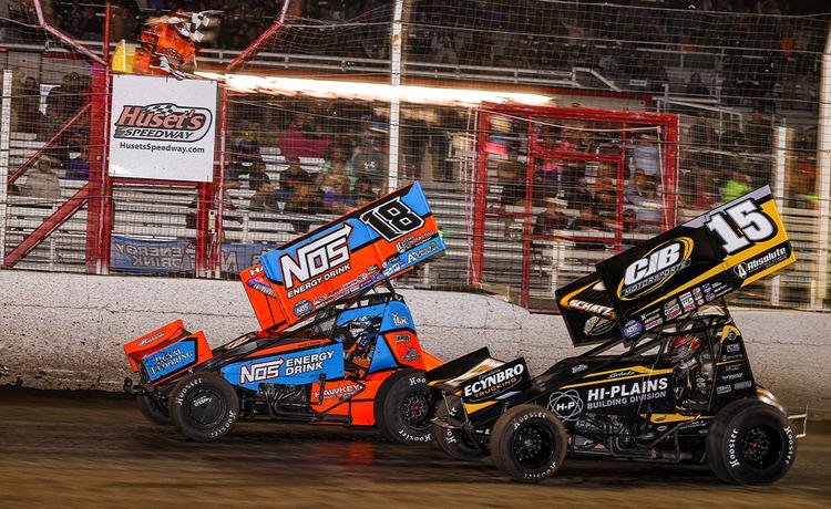 Sheldon Haudenschild racing Donny Schatz to the checkered flag at Huset's Speedway