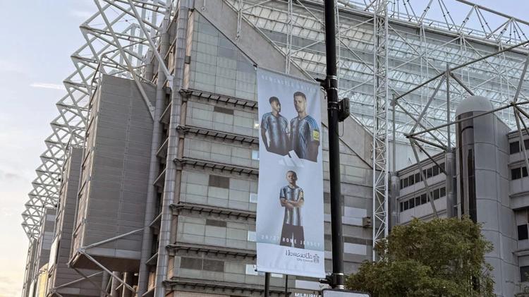 Bruno Guimaraes Jacob Murphy Banner Outside St. James' Park Newcastle United 2026/27 Shirt