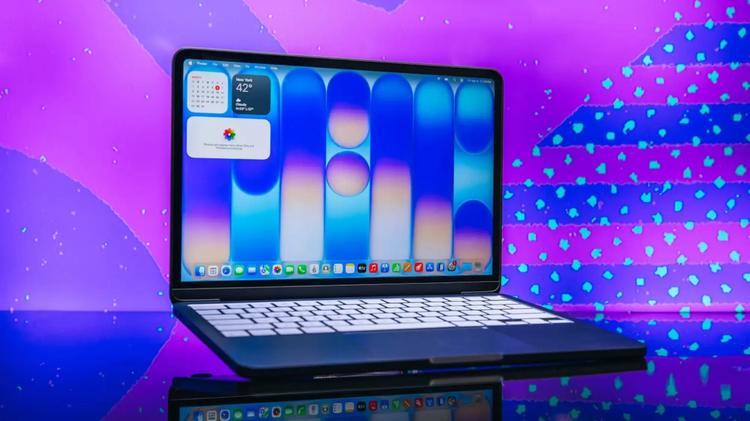 MacBook Neo in front of blue background