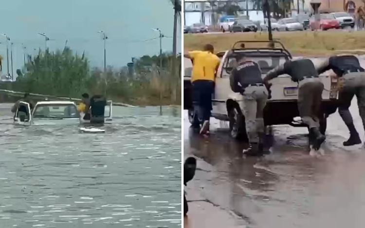 VÍDEO: Policiais entram em enchente para resgatar casal ilhado dentro de carro em Goiás