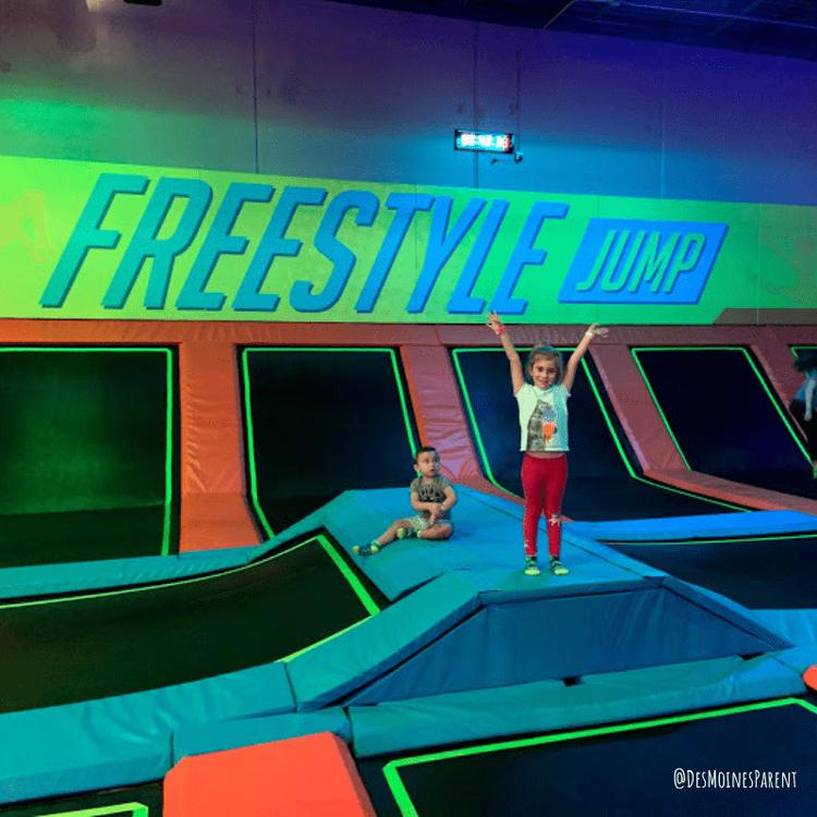 Kids playing at trampoline center.