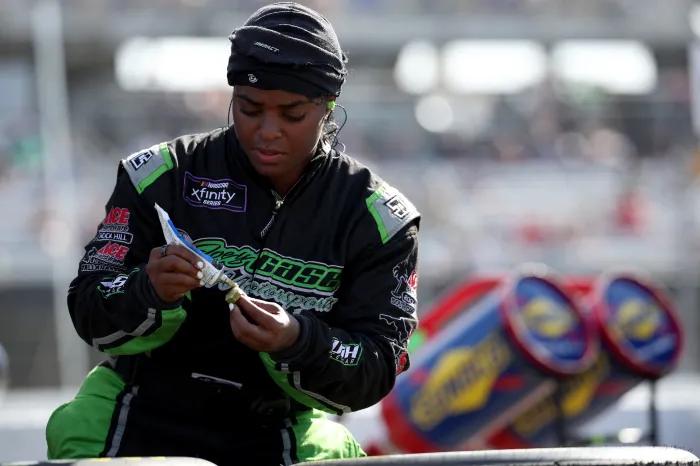 Joey Gase Motorsports pit crew member Brehanna Daniels prepares to change a tire during a race at Darlington Raceway on April 5, 2025, in Darlington, South Carolina. 