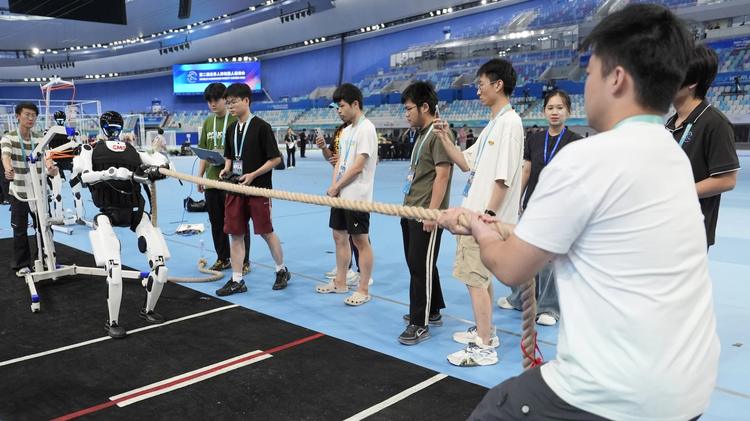 A humanoid robot is preparing for a tug of war competition during 2026 World Humanoid Robotics Federation Games at National Speed Skating Oval on August 18, 2026 in Beijing, China.