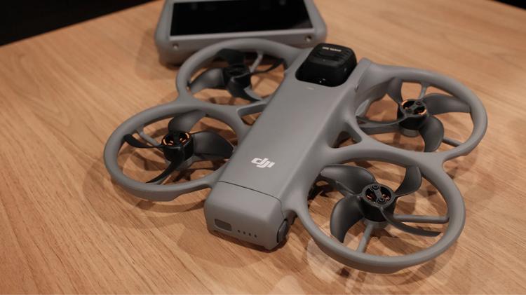 The DJI Avata 360 resting on a table with the DJI RC 2 remote controller in the background.