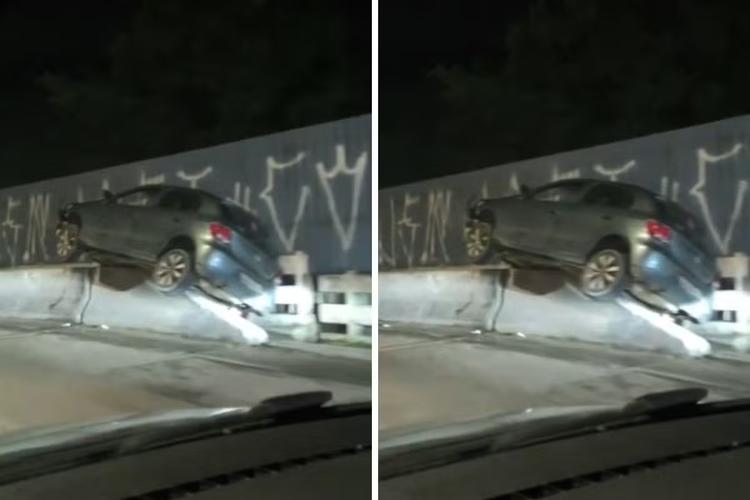 Carro sobe em mureta de ponte após acidente e interdita trecho da Rio-Santos em Caraguatatuba