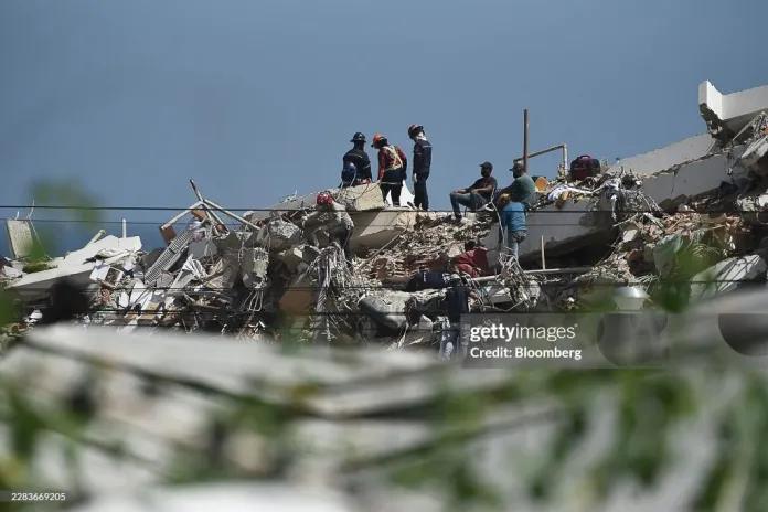 Rescue workers in search of survivors in destroyed buildings following the June 24 earthquakes in Los Corales, La Guaira state, Venezuela, on Wednesday, July 1, 2026. 