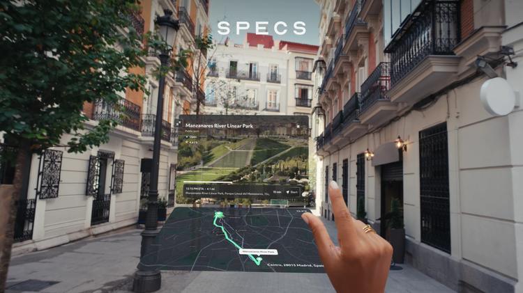 POV view of someone looking at a map with snap specs ar glasses on city street
