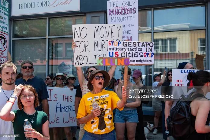 Demonstrators protest a federal law enforcement involved shooting in Biddeford, Maine on July 13, 2026. 