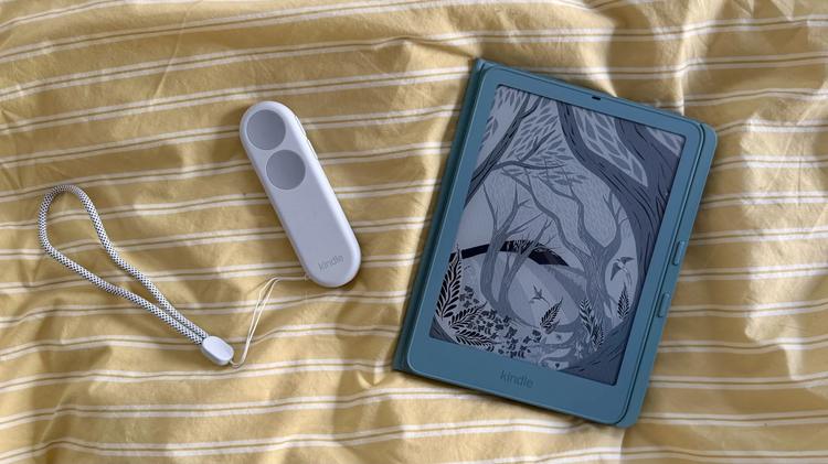 The Kindle Paperwhite Signature Edition with a page-turn cover and Kindle Click