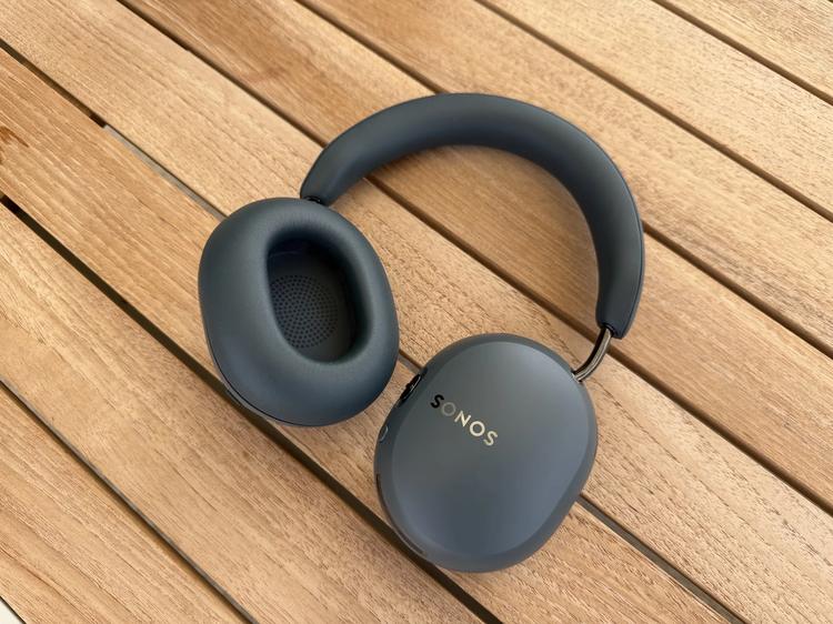 Sonos Ace Ultra headphones on wood panels