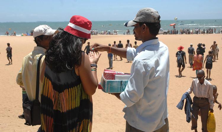 Police need to act against touts, says tourism minister