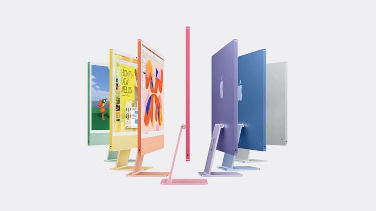 row of apple imac devices in rainbow of colors