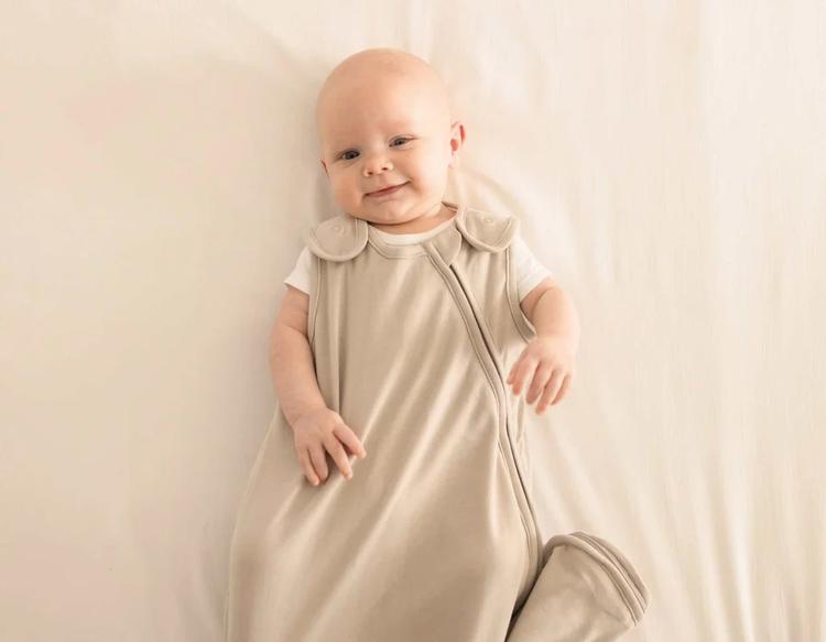 Baby resting comfortably in bed while wearing a breathable KeaBabies Soothe Sleep Sack for safe and cozy sleep.