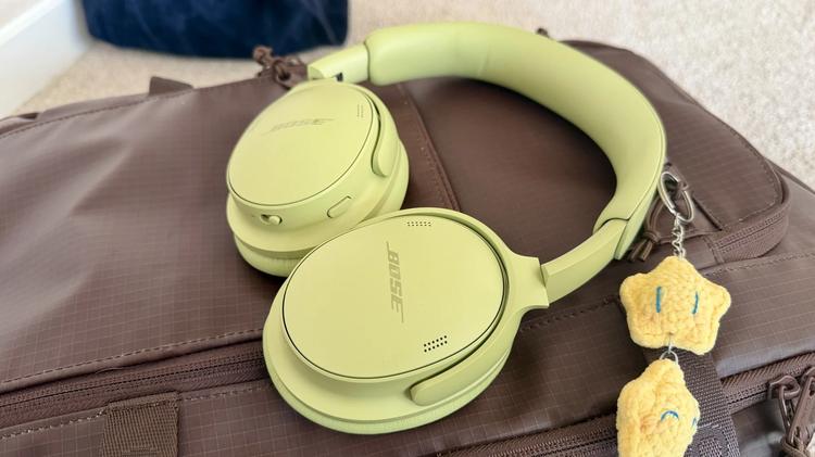 green bose headphones on top of duffel bag