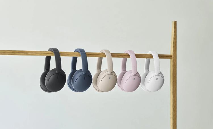 Sony WH-CH730N headphones hanging from a rod