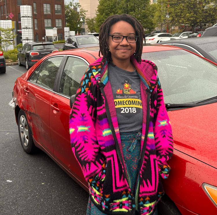 Cierra Mayo stands by her car in Reading