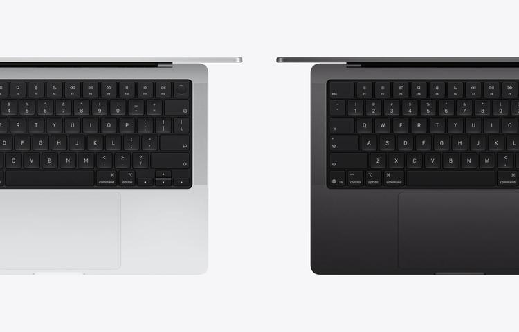 top-down views of silver and space black apple macbook pros