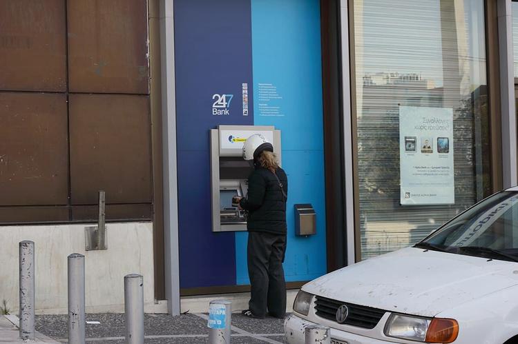 The End of “Free” Banking: Greece Follows the Global Trend