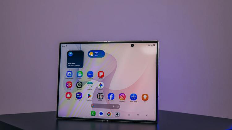 the galaxy z fold 8 on a pedestal opened to home screen